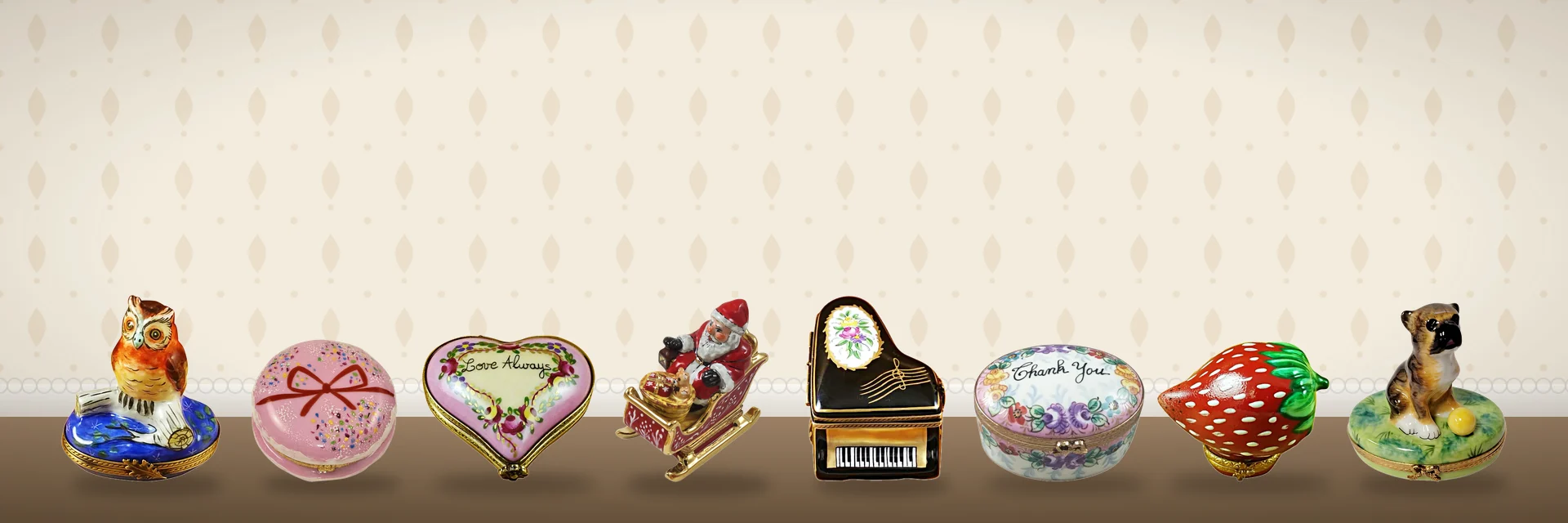 Hand-painted French Limoges boxes arranged on a painted backdrop