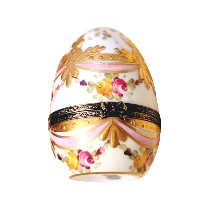 Pink egg with gold ribbons, a hand-painted Limoges porcelain box